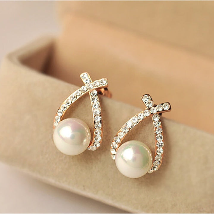 Brincos com pérolas e brilho